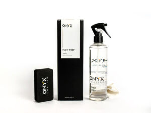 Bottle of Onyx Paint Prep, preparing car exterior for ceramic coating by removing residues and contaminants.