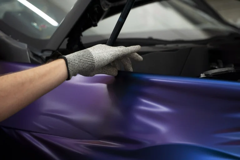 auto-service-salon-doign-car-wrapping using Luminous colored PPF