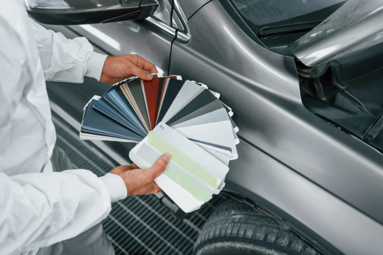 holds-cards-with-different-Luminous-colored-PPF-caucasian-automobile-repairman-uniform-works-garage
