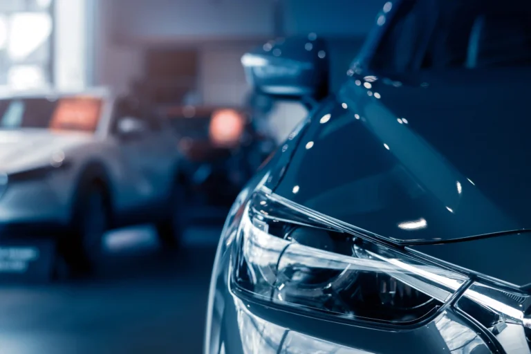 selective-focus-grey-car-parked-luxury-showroom-car-dealership-office-new-car-parked